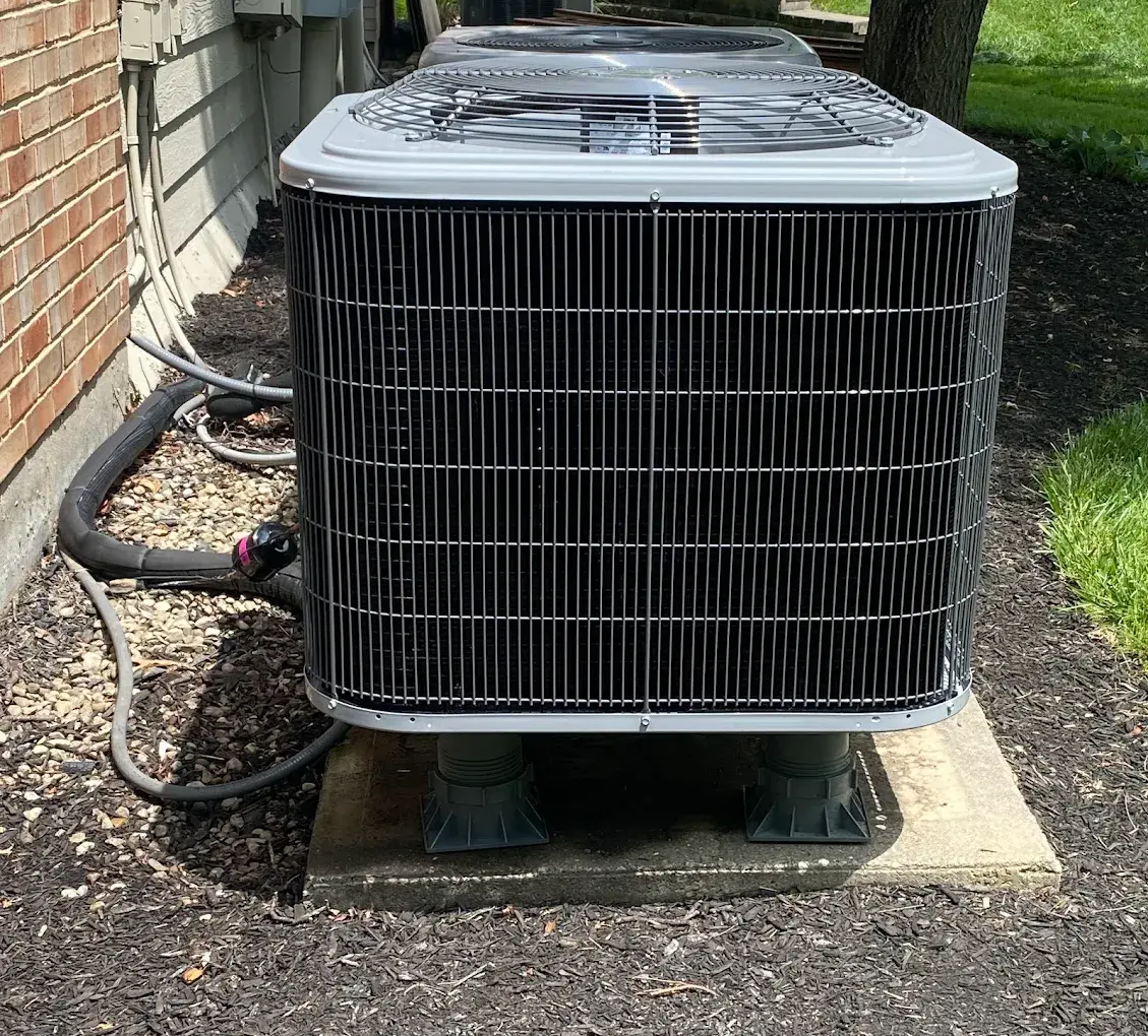 Residential AC condenser installed by Watson Heating + Cooling